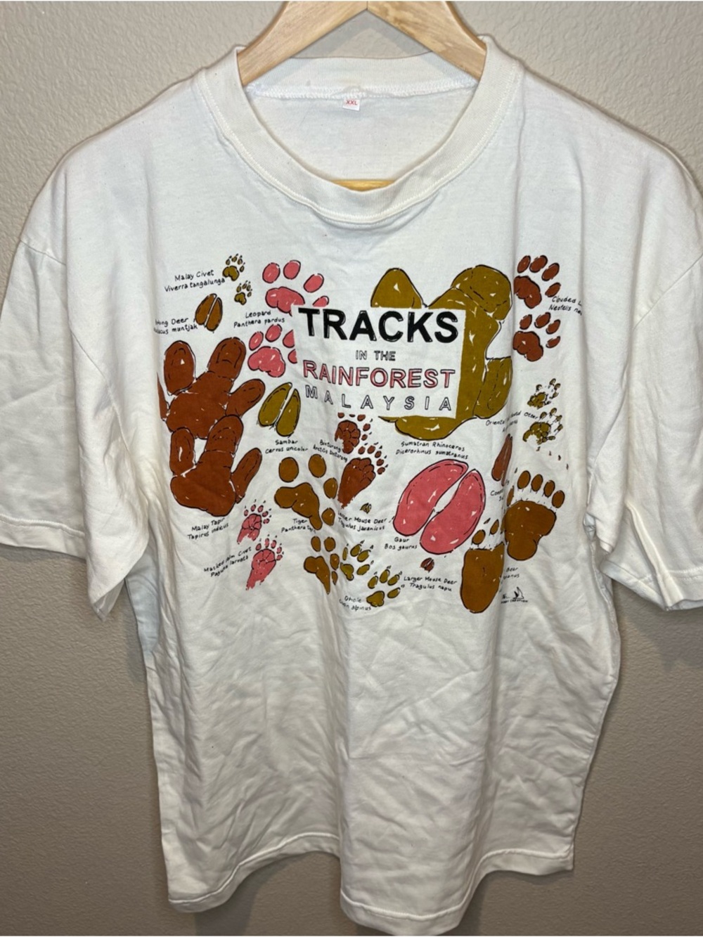 Trac White Short Sleeve Tee with Colorful Footprint Graphic